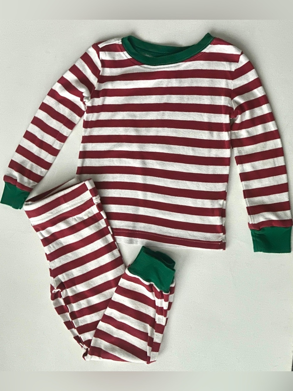 Hanna Andersson kids’s striped pajama set with red, white and green.  Size 4T.